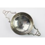 A 19th century white metal continental lemon strainer,