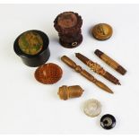 A selection of carved sewing items, to include; a coquilla nut bobbin case