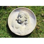 A composition stone circular plaque,