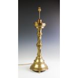 An ecclesiastical brass lamp base of large proportions,
