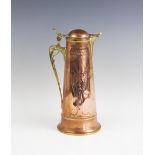 An Art Nouveau copper and brass ewer or wine jug of tapering cylindrical form,