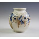 A Moorcroft Orchid and Spring Flowers pattern vase,
