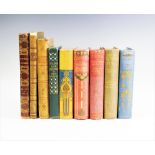 A collection of travel related books, in decorative bindings