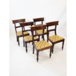 A set of five early 19th century mahogany dining chairs,