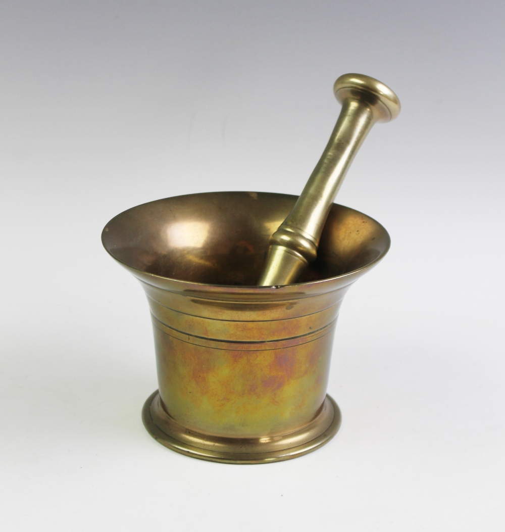 A bronze pestle and mortar,