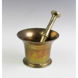 A bronze pestle and mortar,