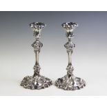 A pair of early 19th century silver candlesticks,