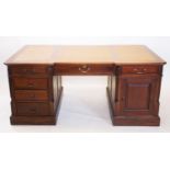 A George III style mahogany partners desk, 20th century, the inverted desk top