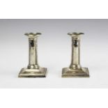 A pair of Victorian silver candlesticks,