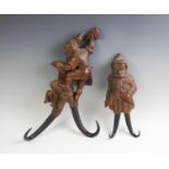 An early 20th century Black forest gnome figural wall mounted coat or hat hook,