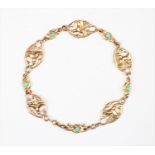 A Victorian turquoise set bracelet, designed as five oval links depicting lilies