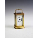 A presentation brass carriage timepiece by 'St James, London',