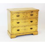 An Edwardian scumbled pine chest of two short and two long drawers,