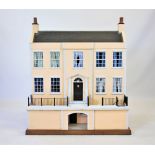 A Georgian style three storey dolls house,