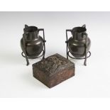 A pair of early 20th century Liberty style pewter vases,