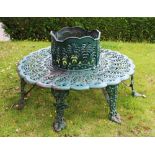 A Victorian style cast iron, green painted tree seat of circular form