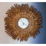 A late 19th century gilt wood sunburst clock,