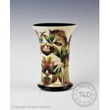 A Moorcroft vase of trumpet form, decorated with the ?Elderberry? design by Philip Gibson 2004,