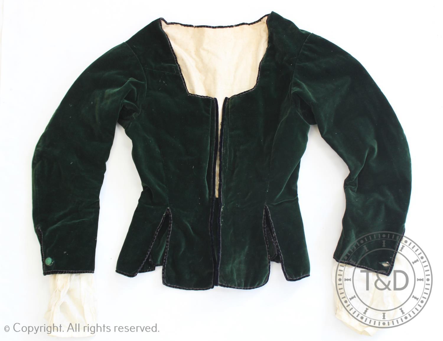 A lady?s forest green velvet bodice, 18th century style, with centre front hooks for lacing and