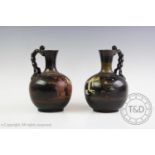 Two Apulian ceramic blackware lekythos, possibly 5th-3rd century BC. each with flared neck and