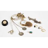 An assortment of vintage and costume jewellery, to include: a Victorian jet mourning brooch, two