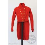 A red facecloth coat, circa 1820, with Eton College buttons to the front, lacking braiding (at