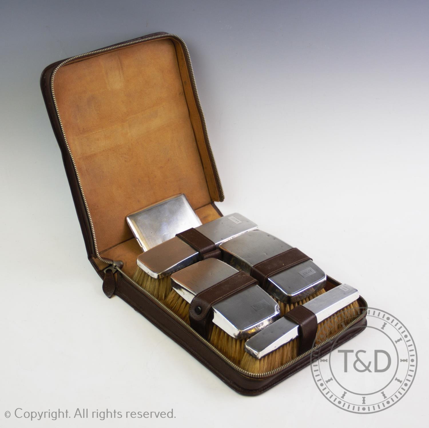 A gentleman's silver backed dressing table set, Barker Brothers Silver Ltd, Birmingham 1935,