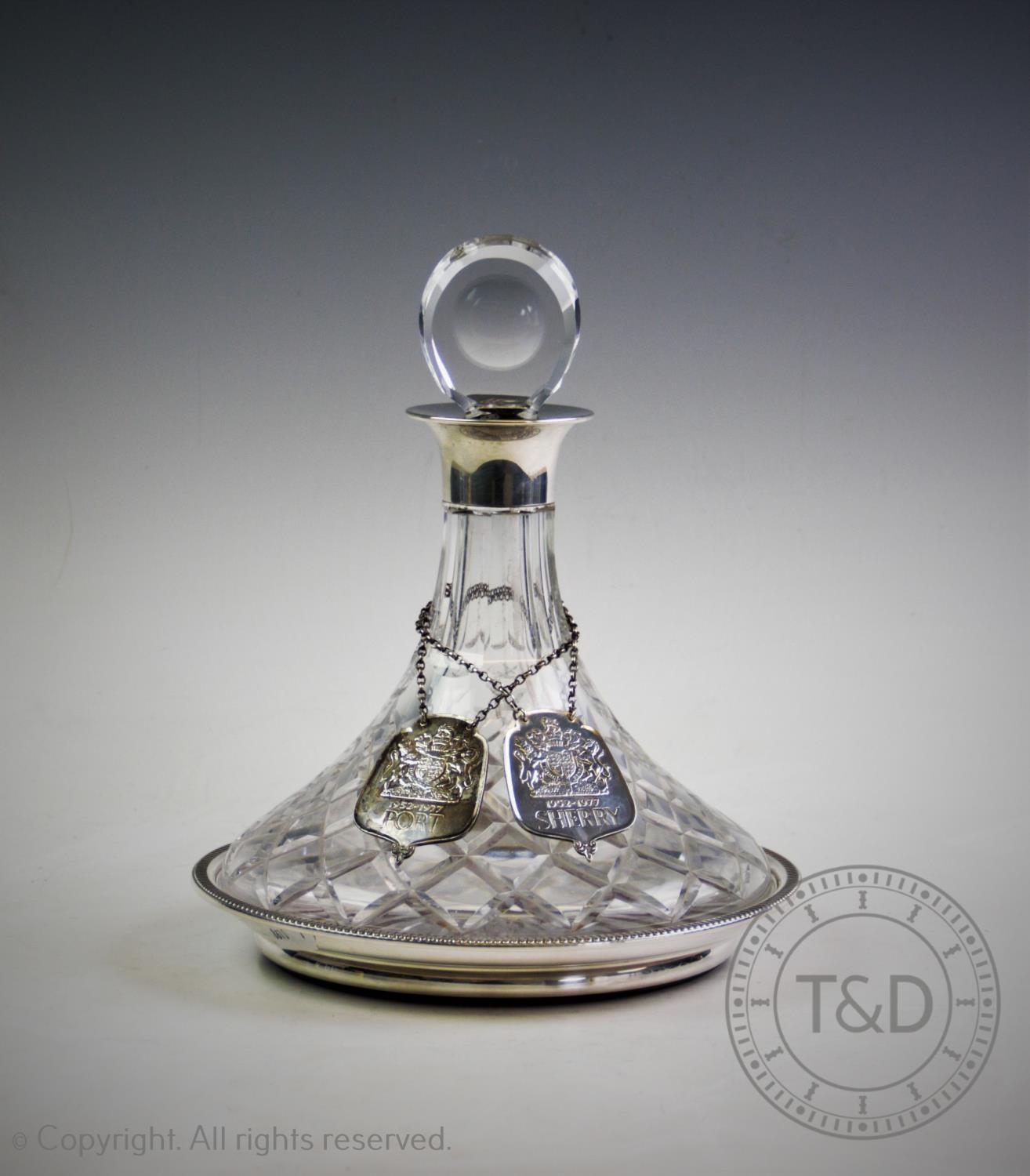 A silver mounted ships decanter, J B Chatterley & Sons Ltd, Birmingham 1976, with cut glass tapering