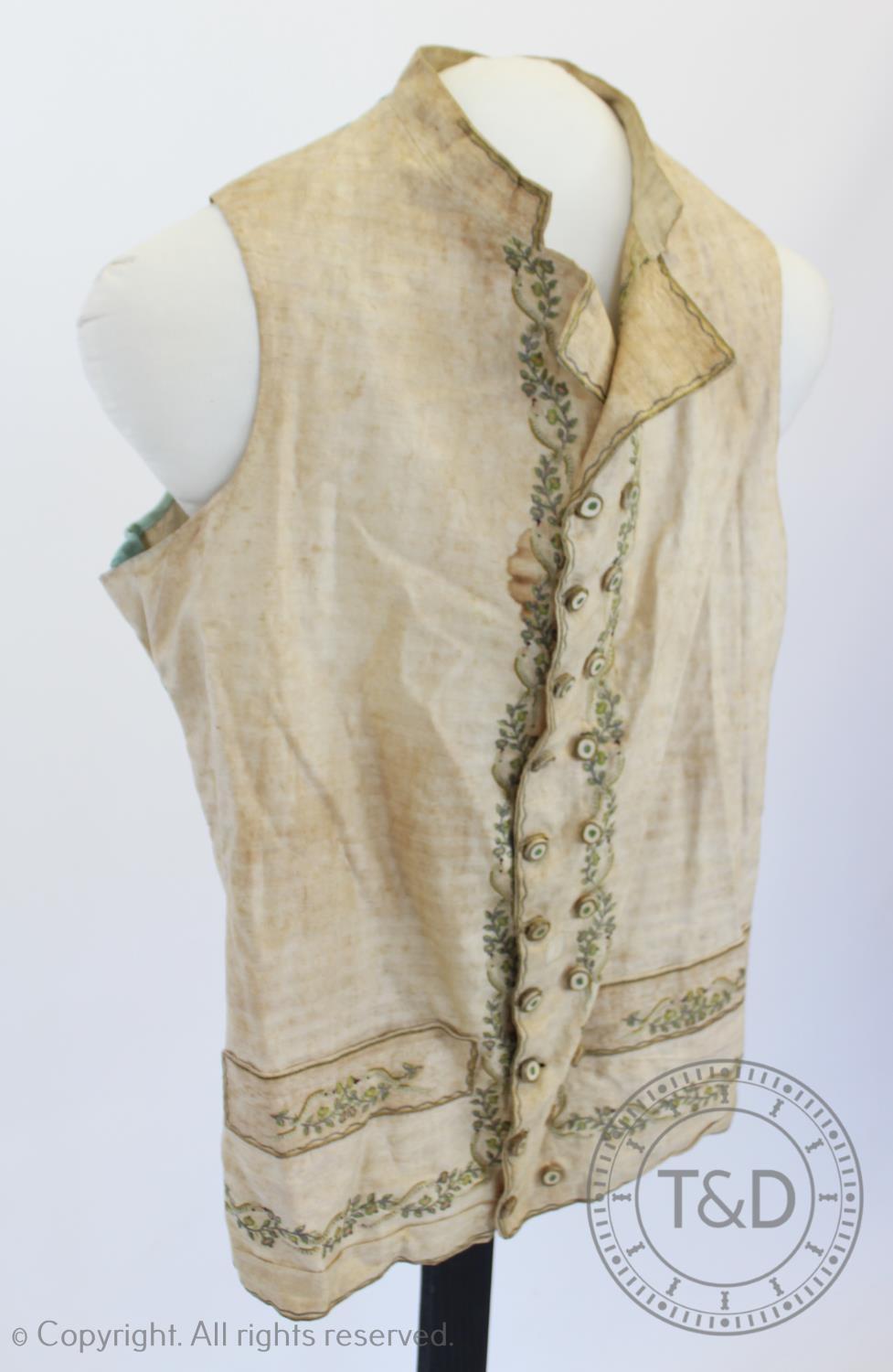 An ivory striped woven cotton waistcoat, circa 1800, the edges decorated with foliate sprays and - Image 6 of 9