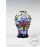 A Moorcroft vase of inverted baluster form, decorated with a floral design dated 2005, possibly by