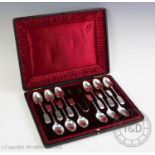 A Victorian cased set of twelve silver fiddle pattern spoons, Walker & Hall, Sheffield 1899, with