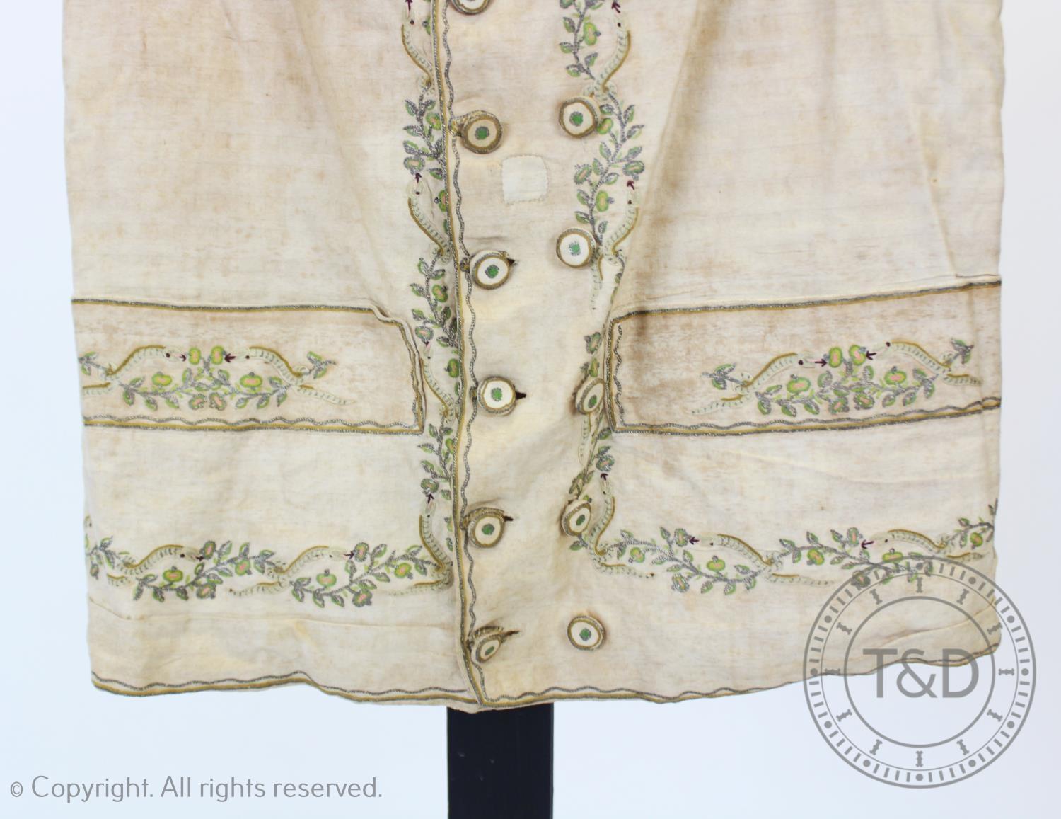 An ivory striped woven cotton waistcoat, circa 1800, the edges decorated with foliate sprays and - Image 4 of 9