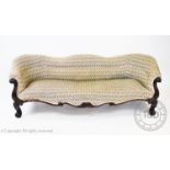 A William IV serpentine rosewood settee, the undulating padded back above a sprung serpentine