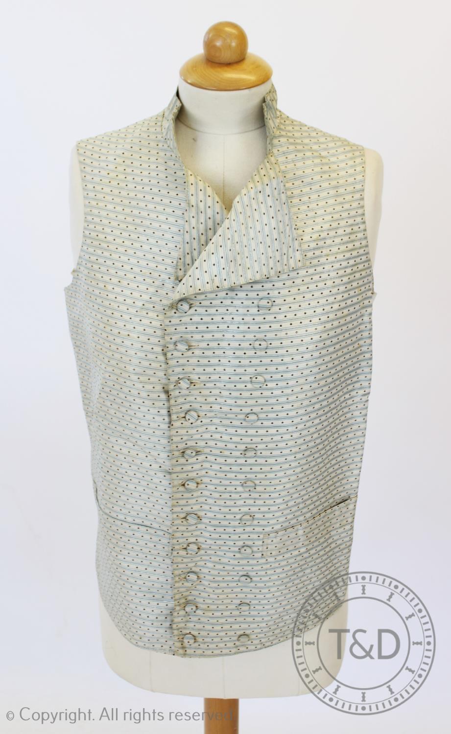 An ivory striped woven cotton waistcoat, circa 1800, the edges decorated with foliate sprays and - Image 2 of 9