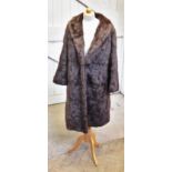 A vintage three-quarter length mink coat, the dark brown coat with silk lining, length approx.
