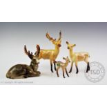 A Beswick deer family, comprising a stag, a hind and a calf, each with maker's mark to base, the