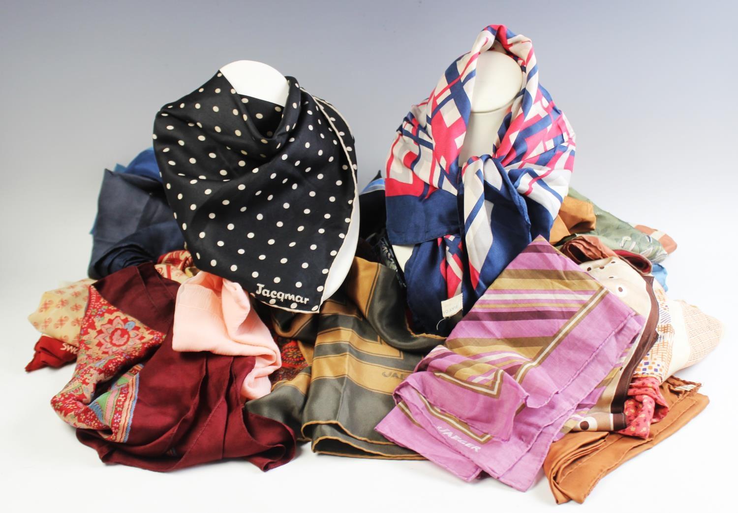A collection of ladies silk scarves, to include Jaegar examples, a Jaques Piaget scarf and a