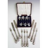 A set of twelve Victorian silver dessert knives and forks, Martin Hall & Co, Sheffield 1867, the