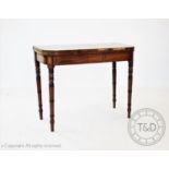 A Regency inlaid mahogany tea table, on ring turned legs, 73cm H x 90cm W x 44cm D