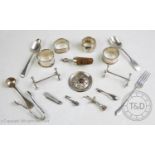 A selection of silver and white metal items, to include, a pair of Victorian silver knife rests, a