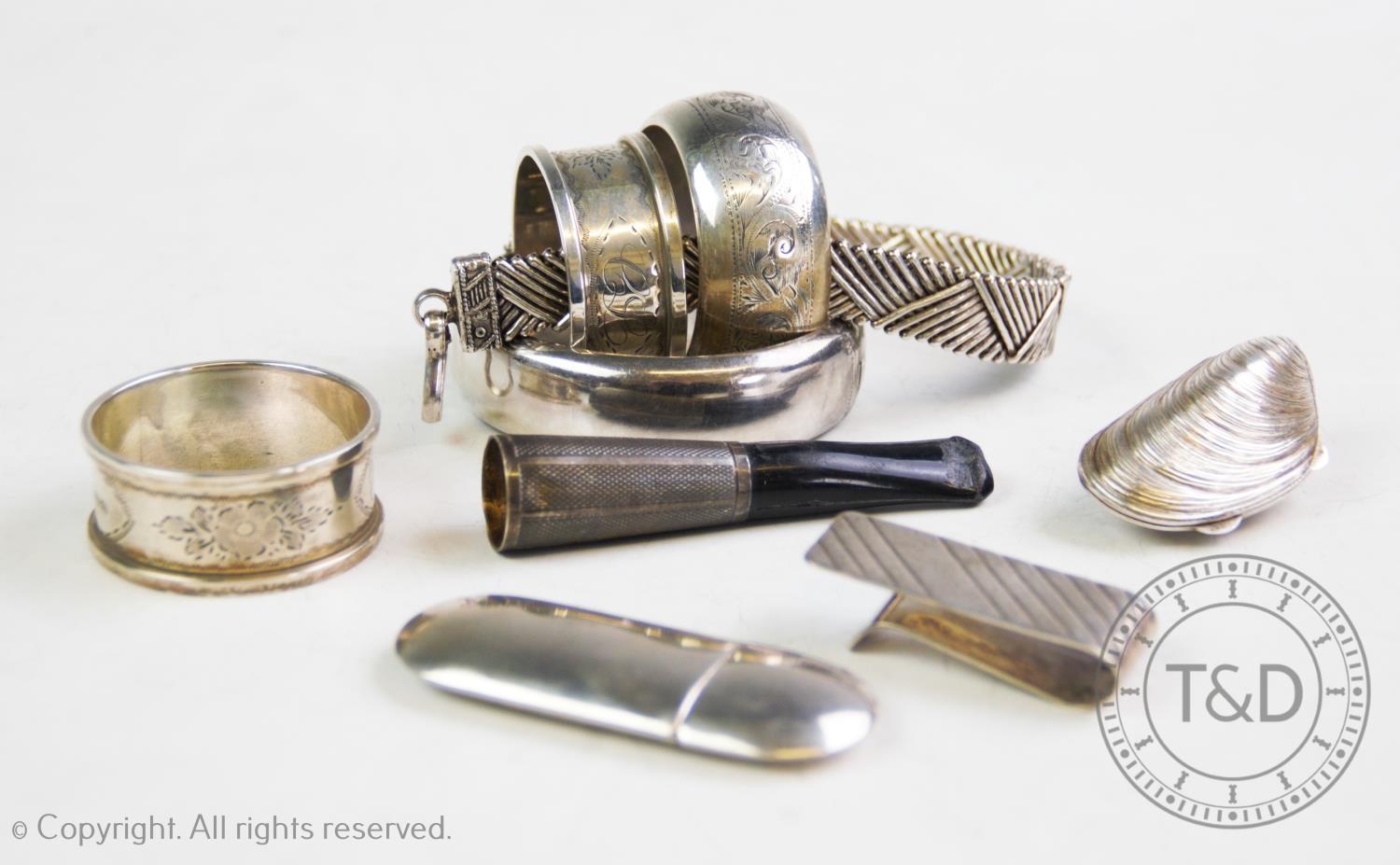 A selection of silver and silver coloured items, comprising: a silver hinged bangle, C P S Jewellery