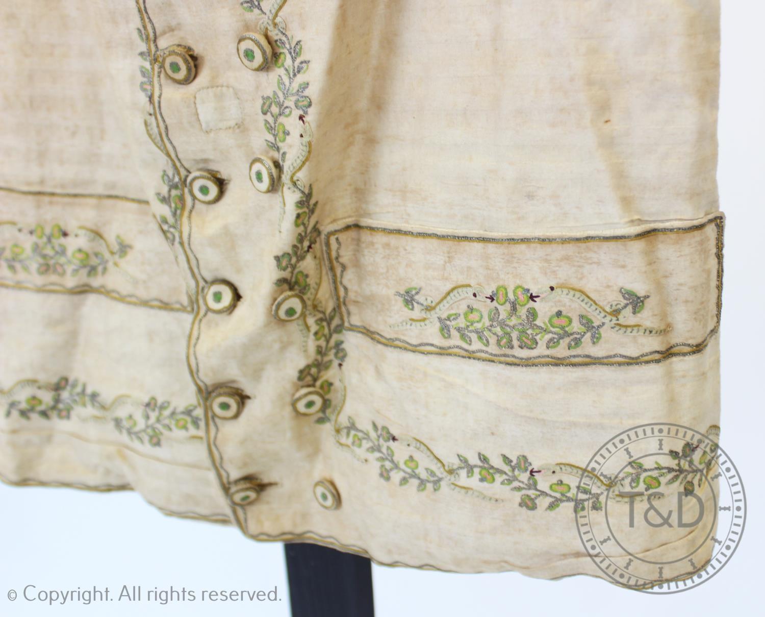 An ivory striped woven cotton waistcoat, circa 1800, the edges decorated with foliate sprays and - Image 3 of 9