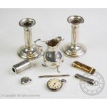 A selection of 20th century and earlier silver and silver coloured items, comprising: a pair of