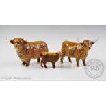 A Beswick Highland cattle family, comprising a bull, a cow and a calf, the bull and cow with maker's