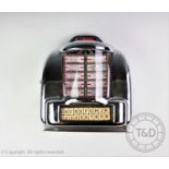 A Leisure sound wall mounted jukebox selector cabinet, chromed metal with transparent bow front