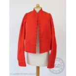 An early 19th century red facecloth sleeved waistcoat with covered buttons and a chamois leather