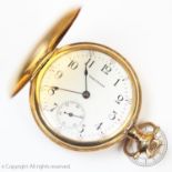 A 14ct gold Waltham full hunter lady's fob watch, the white enamel dial with Arabic numerals and