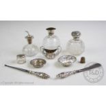 An assortment of silver items, comprising: an Edwardian silver topped perfume bottle, Birmingham