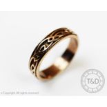 A 9ct gold Clogau ring, the band decorated with Celtic knots, size O, gross weight 3.4gms, with