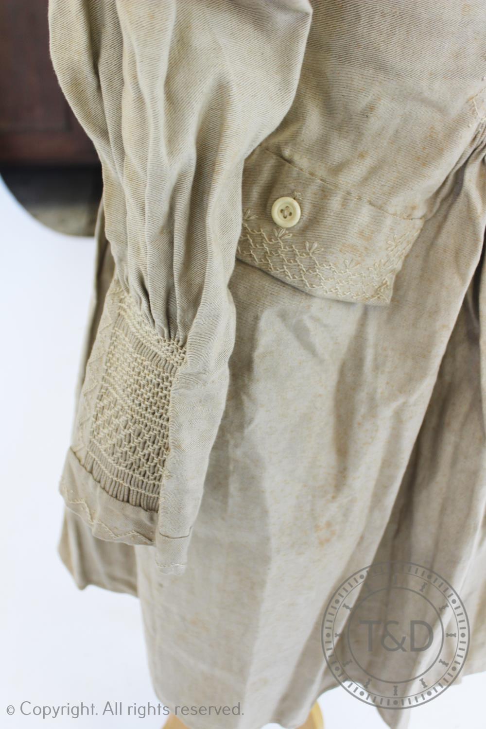 An early 19th century natural heavy twill cotton smock, with smocked detail to the front, back and - Image 2 of 4